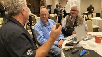 photo CJ Buck at NASC meeting talking to state legislators